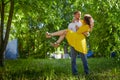 A date between a young girl and a guy on a Sunny summer day. Young beautiful couple on walk in the city. Man and woman at a love Royalty Free Stock Photo