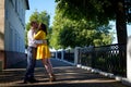 A date between a young girl and a guy on a Sunny summer day. Young beautiful couple on walk in the city. Man and woman at a love Royalty Free Stock Photo