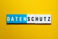 Datenschutz - data protection on german,word concept on building blocks, text Royalty Free Stock Photo