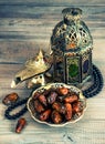 Dates, arabic lantern and rosary. Oriental decoration