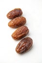 Dates arranged in a white bowl Royalty Free Stock Photo