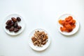 Dates, dried apricots, walnuts on a white background Royalty Free Stock Photo