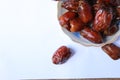 dates fruit frame template, arabic food, pile on small plate, isolated white background cover Royalty Free Stock Photo