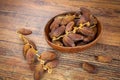 Dates isolated on a wooden table