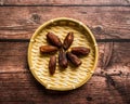 Dates or kurma on a wooden table Royalty Free Stock Photo