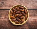 Dates or kurma on a wooden table Royalty Free Stock Photo