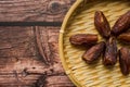 Dates or kurma on a wooden table