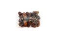 Dates in a plastic bag on a white background.