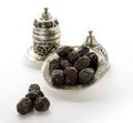 Dates in Plate with coffee - organic dates over white background - Bowl of dried dates isolated on white background