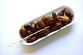 Dates are ripe and delicious on a white plastic backing Royalty Free Stock Photo