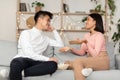Dating Asian Couple Having Stay-At-Home Date, Flirting And Talking Indoors Royalty Free Stock Photo