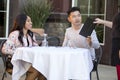 Dating Couple Ordering at an Outdoor Restaurant Royalty Free Stock Photo