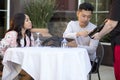 Dating Couple Ordering at an Outdoor Restaurant Royalty Free Stock Photo