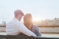 Dating or first love, young couple sitting together on the bench Royalty Free Stock Photo