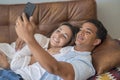 Dating and relationship. Young couple interracial black boy and caucasian girl enjoying time at home in indoor leisure activity Royalty Free Stock Photo