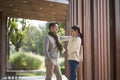 Young asian couple talking chatting outdoors in city park Royalty Free Stock Photo