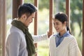 Young asian couple talking chatting outdoors in city park Royalty Free Stock Photo