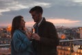 dating, young couple drinking champagne in Paris by night, France