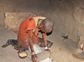 Datoga Woman Grinding Corn