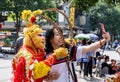 Woman takes selfie by smart phone with Monkey King or Sun Wukong