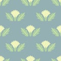 Datura flowers seamless pattern with leaves in yellow-green colors in geometric style.