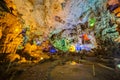 DAU GO CAVE, VIETNAM - CIRCA AUGUST 2015: Colorful illumination in Dau Go cave in Halong Bay, Vietnam Royalty Free Stock Photo