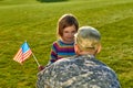 Daughter with american flag and her daddy.