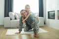 Lovely beaming girl sitting on back of father feeling happy Royalty Free Stock Photo