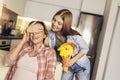 Daughter congratulates mom and gives her flowers Royalty Free Stock Photo