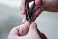 A Daughter cuts fingernails of a grandmother, Daughter cutting a