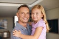 Daughter, dad and portrait for embrace, family and home with smile and playtime with hug. Father, little girl and happy Royalty Free Stock Photo