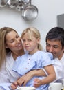 Daughter disliking food with her parents Royalty Free Stock Photo