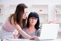 Daughter explaining to mom how to use computer Royalty Free Stock Photo