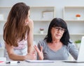 Daughter explaining to mom how to use computer Royalty Free Stock Photo