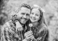 Daughter and father with dandelion flower. family summer farm. little girl and happy man dad. earth day. spring village Royalty Free Stock Photo