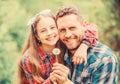 Daughter and father with dandelion flower. family summer farm. little girl and happy man dad. earth day. spring village Royalty Free Stock Photo