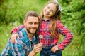 Daughter and father with dandelion. spring village country. ecology. Happy family day. little girl and happy man dad Royalty Free Stock Photo