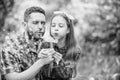 Daughter and father love dandelion flower. family summer farm. spring village country. little girl and happy man dad Royalty Free Stock Photo