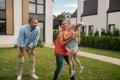 Daughter feeling entertained having fun with parents Royalty Free Stock Photo