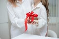 Daughter giving her mother a christmas present Royalty Free Stock Photo