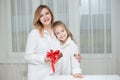 Daughter giving her mother a christmas present Royalty Free Stock Photo