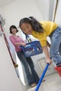 Daughter Helping Mother In Cleaning Floor Royalty Free Stock Photo