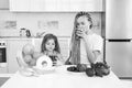 Daughter and her happy mother drinks green smoothie. Vegan meal and detox menu. Mother and daughter drinking green Royalty Free Stock Photo