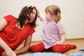 Daughter and her mother are solving puzzle