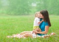 Daughter kissing mother with love Royalty Free Stock Photo