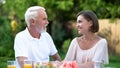 Daughter-in-law talking to father-in-law, respectful relations and understanding