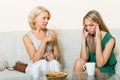 Daughter and mature mother having serious talking Royalty Free Stock Photo