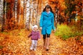 Daughter with mom running in the woods Royalty Free Stock Photo