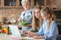 Daughter, mother and grandmother spending time together and cooking Royalty Free Stock Photo