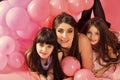 Daughter of the mother. Little girls, mom in pink balloons.